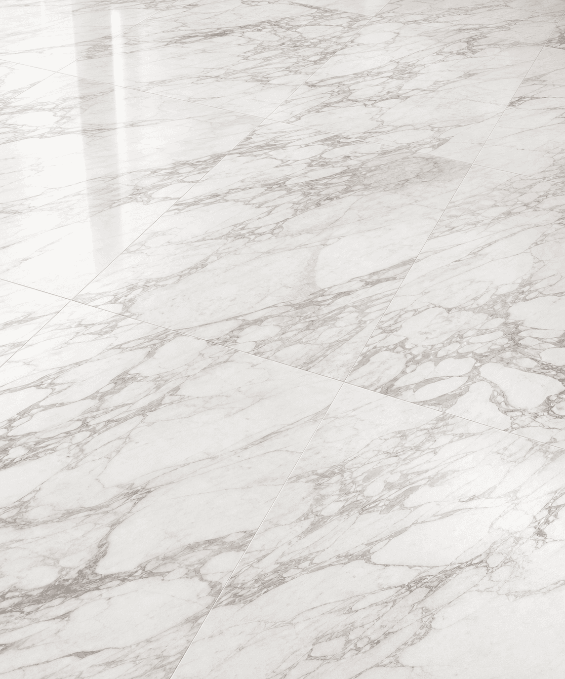 Calacatta-style marble flooring and stone tiles for a custom interior